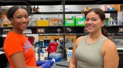Ashley Malcolm and Vanessa Gonzalez posing in the lab